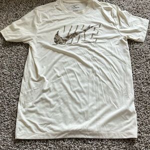 I’m selling a cream colored Nike shirt